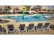Relax by the community pool that has fun water features and plenty of lounge seating at 4083 E Rustler Way, Gilbert, AZ 85297