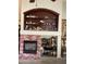 Charming fireplace featuring a brick surround and a built-in display niche perfect for showcasing collectibles and décor at 4083 E Rustler Way, Gilbert, AZ 85297