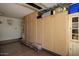 This garage offers custom built-in storage cabinets and ample space for organization at 4083 E Rustler Way, Gilbert, AZ 85297