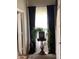 Hallway displaying a serene plant arrangement that adds a touch of nature indoors, complemented by an accent window at 4083 E Rustler Way, Gilbert, AZ 85297