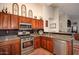 Well-equipped kitchen with stainless steel appliances and granite countertops offers a modern and stylish design at 4083 E Rustler Way, Gilbert, AZ 85297