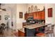 Open kitchen with breakfast bar, stainless appliances, and granite countertops offers a warm, inviting design at 4083 E Rustler Way, Gilbert, AZ 85297