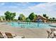 Community splash pad with plenty of room for residents to soak up the sun on the pool deck at 4083 E Rustler Way, Gilbert, AZ 85297