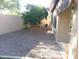 The side yard is xeriscaped with decorative rocks and desert landscaping for low maintenance and beauty at 4083 E Rustler Way, Gilbert, AZ 85297