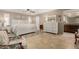 Neutral-toned bedroom with white furnishings, decorative wall art, and tile flooring at 410 E Beck Ln, Phoenix, AZ 85022