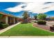 Lush green front yard with decorative rock landscaping and manicured bushes enhancing the home's curb appeal at 410 E Beck Ln, Phoenix, AZ 85022