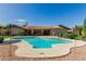 Inviting pool area featuring a sparkling pool, concrete decking, and lush landscaping for outdoor enjoyment at 410 E Beck Ln, Phoenix, AZ 85022