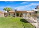 Expansive backyard with a well-manicured lawn, enclosed by fencing for privacy at 4213 W Calle Lejos --, Glendale, AZ 85310