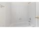 Clean white bathtub and shower with tiled walls at 4213 W Calle Lejos --, Glendale, AZ 85310