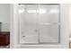 Bathroom featuring a shower-tub combination, blending practicality with a clean aesthetic at 4213 W Calle Lejos --, Glendale, AZ 85310