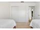 Bright bedroom featuring twin beds, neutral carpet, and a closet for ample storage at 4213 W Calle Lejos --, Glendale, AZ 85310