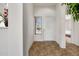 Welcoming entryway featuring tiled floors, a window with blinds and white walls at 4213 W Calle Lejos --, Glendale, AZ 85310