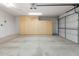 The two car garage has cabinet storage and epoxy floors at 4213 W Calle Lejos --, Glendale, AZ 85310