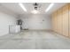 The two car garage has cabinet storage, epoxy floors, and water heater at 4213 W Calle Lejos --, Glendale, AZ 85310