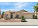 Inviting home exterior with desert landscaping and a well-maintained lawn, showcasing curb appeal at 4213 W Calle Lejos --, Glendale, AZ 85310