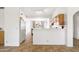 Bright eat-in kitchen with white countertops, stainless steel refrigerator, and stylish tile floors at 4213 W Calle Lejos --, Glendale, AZ 85310