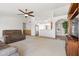 Spacious living room with vaulted ceilings, neutral carpet, and an open layout, perfect for entertaining at 4213 W Calle Lejos --, Glendale, AZ 85310