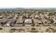 Aerial view of the neighborhood showcasing mature trees, desert landscaping, and mountain views in the distance at 4316 E Strawberry Dr, Gilbert, AZ 85298