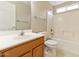 This bathroom features a large mirror, tub, tiled shower, and ceramic floors at 4316 E Strawberry Dr, Gilbert, AZ 85298