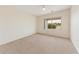 Bright, carpeted bedroom with vaulted ceiling, neutral paint, ceiling fan, and natural light from the window at 4316 E Strawberry Dr, Gilbert, AZ 85298