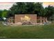 Beautiful community entrance with Trilogy signage, water features, and mature trees at 4316 E Strawberry Dr, Gilbert, AZ 85298