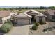 Charming single-story home featuring a tile roof, well-maintained landscaping, and a two-car garage at 4316 E Strawberry Dr, Gilbert, AZ 85298