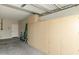 This garage features built in storage cabinets and access to an interior door at 4316 E Strawberry Dr, Gilbert, AZ 85298