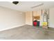 Spacious two car garage with built in storage cabinets and epoxy floor at 4316 E Strawberry Dr, Gilbert, AZ 85298