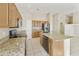 This kitchen features granite countertops, modern appliances, and tile floors at 4316 E Strawberry Dr, Gilbert, AZ 85298