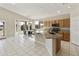 This kitchen and dining space features granite countertops and a window overlooking the backyard at 4316 E Strawberry Dr, Gilbert, AZ 85298