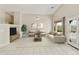 This living room features high ceilings, tile floors, comfortable seating and backyard views at 4316 E Strawberry Dr, Gilbert, AZ 85298