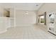 This living room features tile floors, high ceilings, and a large window overlooking the backyard at 4316 E Strawberry Dr, Gilbert, AZ 85298