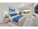 Stylishly furnished main bedroom featuring a king-size bed, vaulted ceilings, and scenic views from the large window at 4316 E Strawberry Dr, Gilbert, AZ 85298