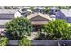 Aerial view of the backyard showcasing landscaping, mature trees and an outdoor grill at 43330 W Delia Blvd, Maricopa, AZ 85138