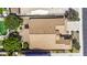 Aerial view of the house showcasing the roof, backyard landscaping, and community at 43330 W Delia Blvd, Maricopa, AZ 85138