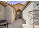 Inviting entrance with arched doorway and desert landscape at 43330 W Delia Blvd, Maricopa, AZ 85138