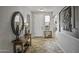 Welcoming foyer with decorative mirror and stylish console table at 43330 W Delia Blvd, Maricopa, AZ 85138