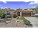 Charming single-story home featuring desert landscaping and a welcoming entrance at 43330 W Delia Blvd, Maricopa, AZ 85138