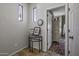 Hallway features tile flooring, decorative decor, and access to the bedrooms at 43330 W Delia Blvd, Maricopa, AZ 85138