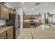 Bright kitchen with stainless steel appliances, granite countertops, and plentiful storage at 43330 W Delia Blvd, Maricopa, AZ 85138