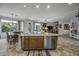 Spacious kitchen with an island that includes a stainless steel dishwasher and eat in dining area at 43330 W Delia Blvd, Maricopa, AZ 85138