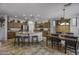 Spacious kitchen with island, wood cabinetry, and a casual dining area at 43330 W Delia Blvd, Maricopa, AZ 85138