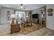 Inviting living room with hardwood floors, comfortable seating, and natural light at 43330 W Delia Blvd, Maricopa, AZ 85138