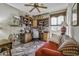 Comfortable office with built in desk, a ceiling fan, and a colorful rug at 43330 W Delia Blvd, Maricopa, AZ 85138