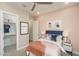 Stylish bedroom featuring modern decor, carpeted floor, ceiling fan, and walk-in closet at 43712 N Acadia Way, New River, AZ 85087