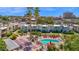 Aerial view of condo complex featuring a pool, shuffleboard court, and well-maintained landscaping at 4600 N 68Th St # 370, Scottsdale, AZ 85251