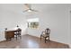 Minimalist bedroom featuring hardwood floors, a small desk, and an oversized ceiling fan at 4600 N 68Th St # 370, Scottsdale, AZ 85251
