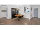 Dining room featuring modern lighting, a black cabinet, and open concept living at 4600 N 68Th St # 370, Scottsdale, AZ 85251