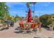 Community grilling area with a table, chairs, umbrella, and BBQ for outdoor entertaining at 4600 N 68Th St # 370, Scottsdale, AZ 85251