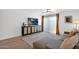 Comfortable living room featuring a large TV, area rug, and hardwood floors at 4600 N 68Th St # 370, Scottsdale, AZ 85251